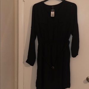 Black dress with sleeves and a built in belt.